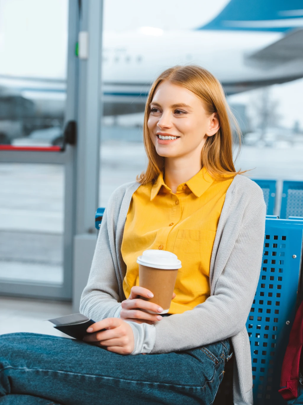 Man_with_coffee_airport.jpg